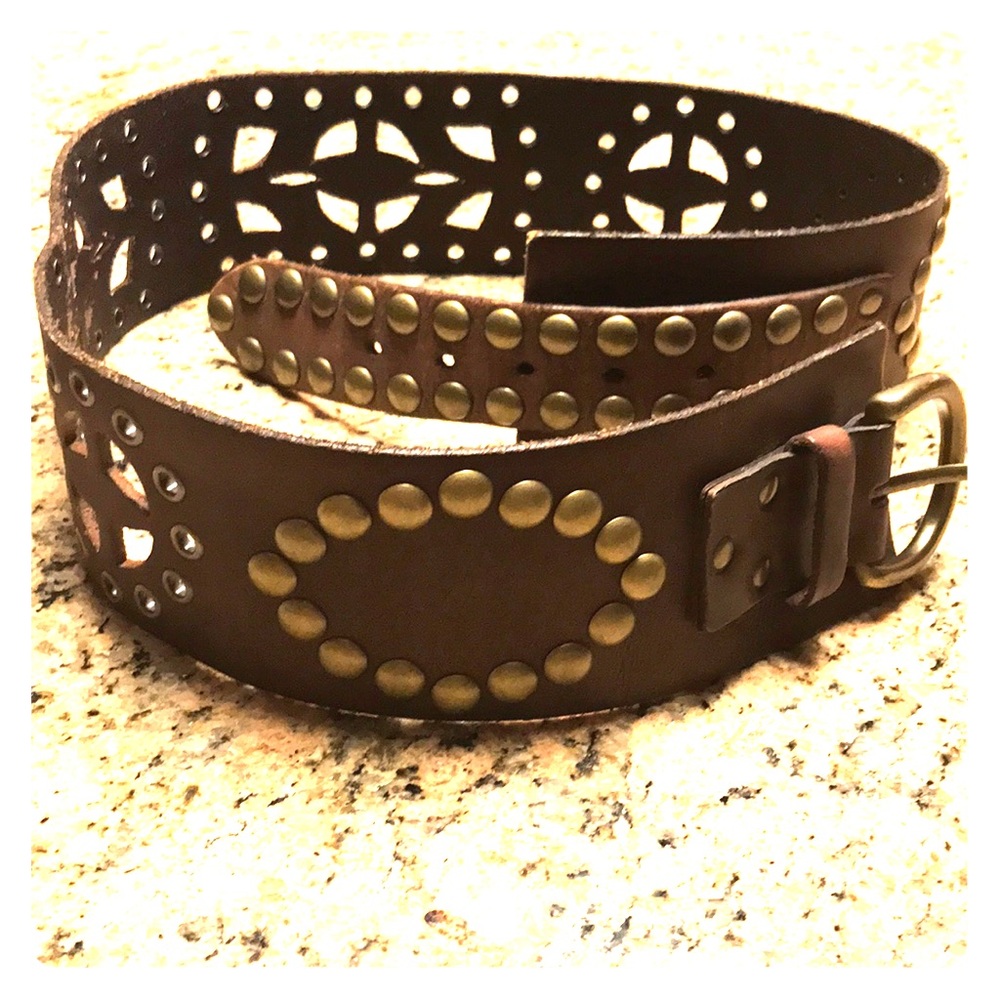 Wide brown leather belt with cutouts and studs